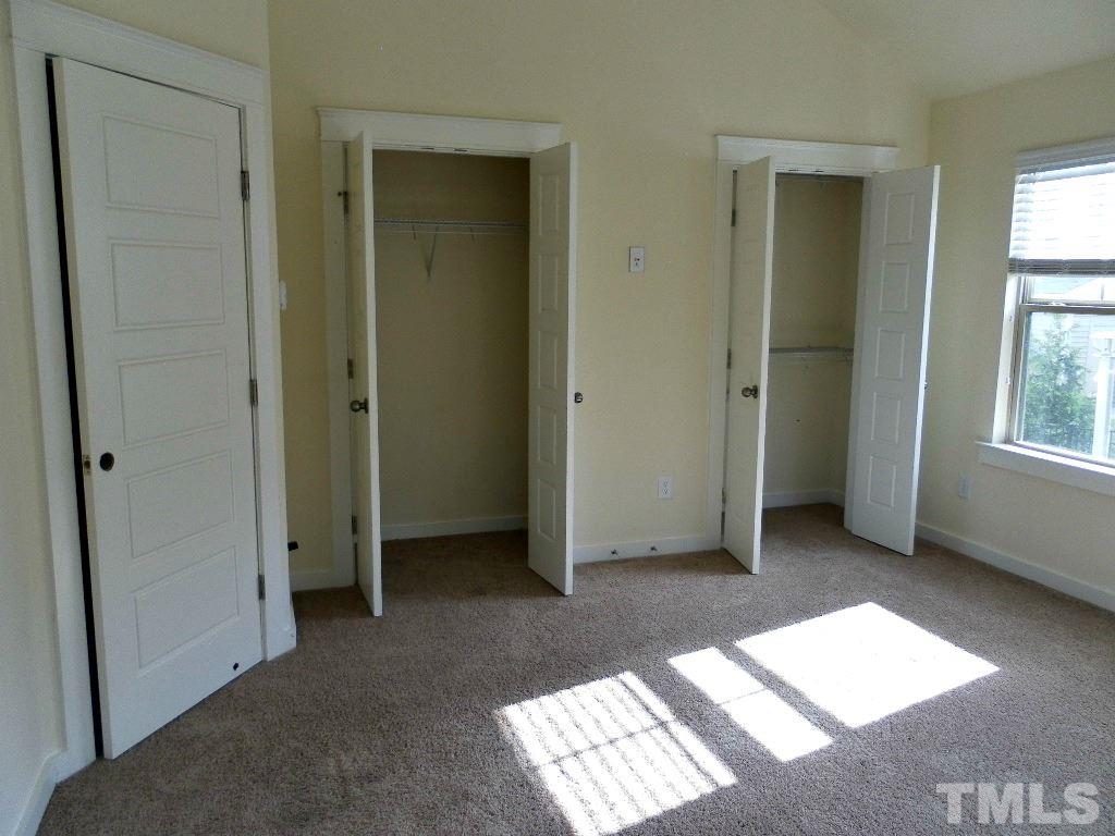 7828 Allscott Way Raleigh, NC 27612 - Photo 14 of 17 a view of an empty room with windows and closet