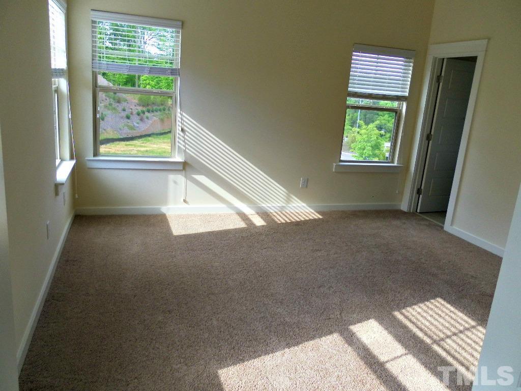 7828 Allscott Way Raleigh, NC 27612 - Photo 15 of 17 a view of an empty room and a window
