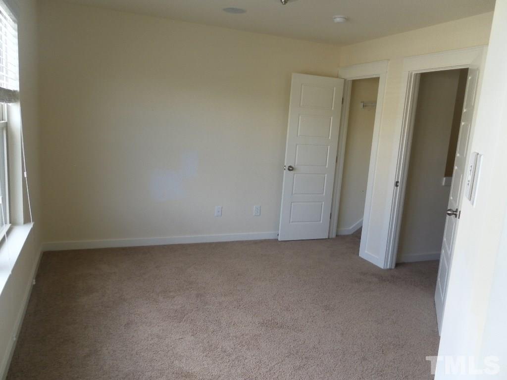 7828 Allscott Way Raleigh, NC 27612 - Photo 16 of 17 an empty room with windows