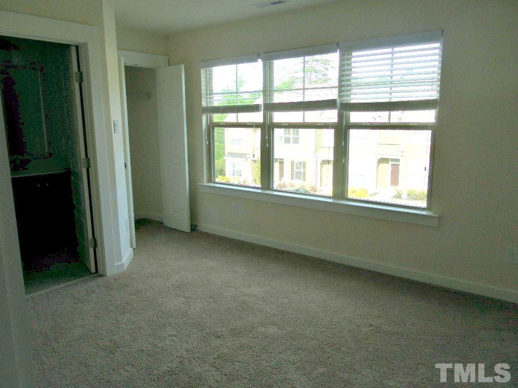 7828 Allscott Way Raleigh, NC 27612 - Photo 17 of 17 an empty room with a window