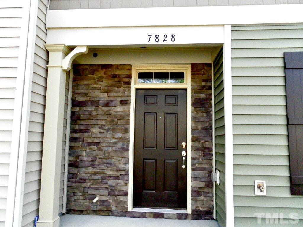 7828 Allscott Way Raleigh, NC 27612 - Photo 6 of 17 a front view of a house with a door