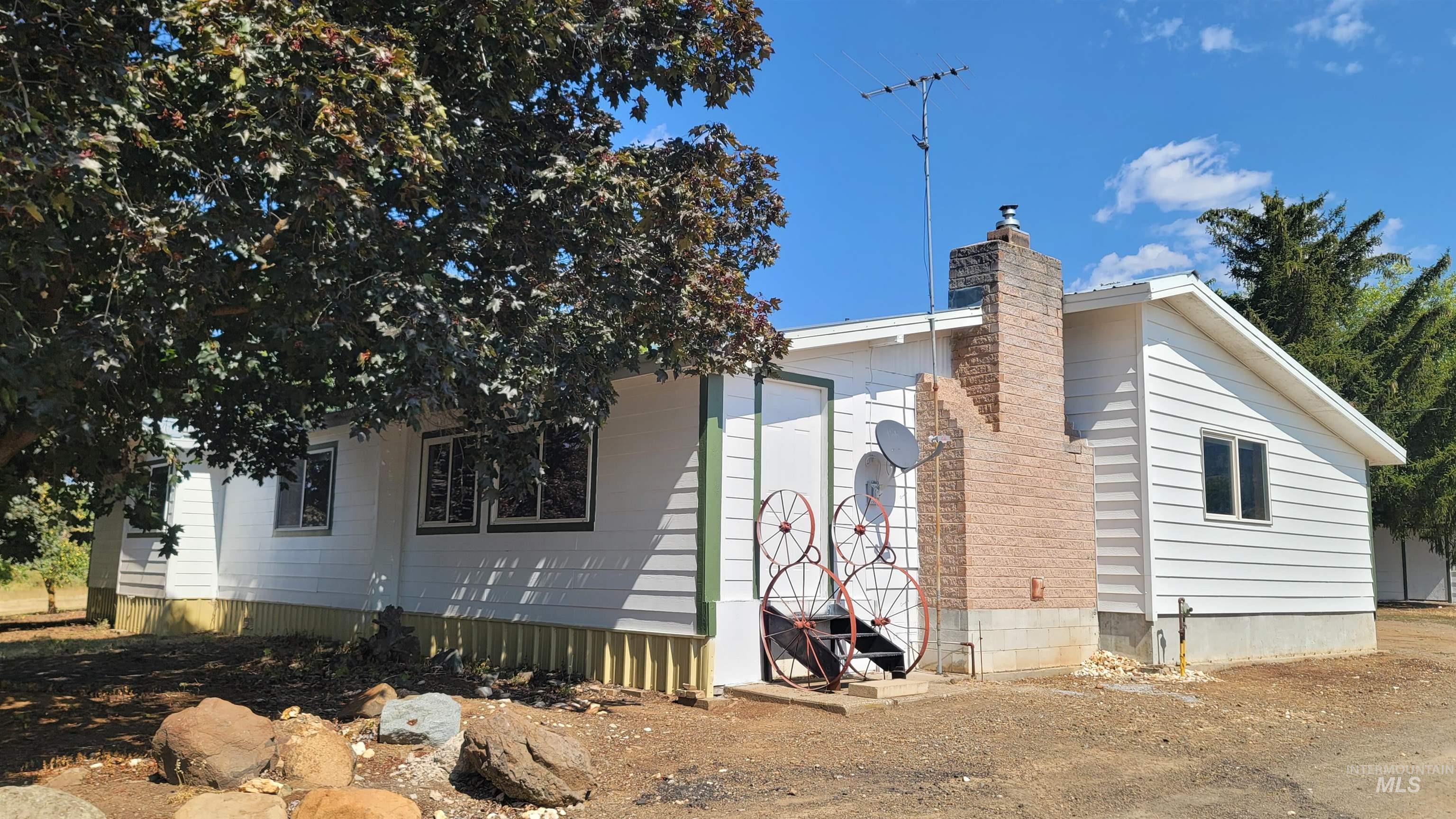 2122 Highway 95 Council, ID 83612 - Photo 2 of 31 View of side of home featuring a chimney