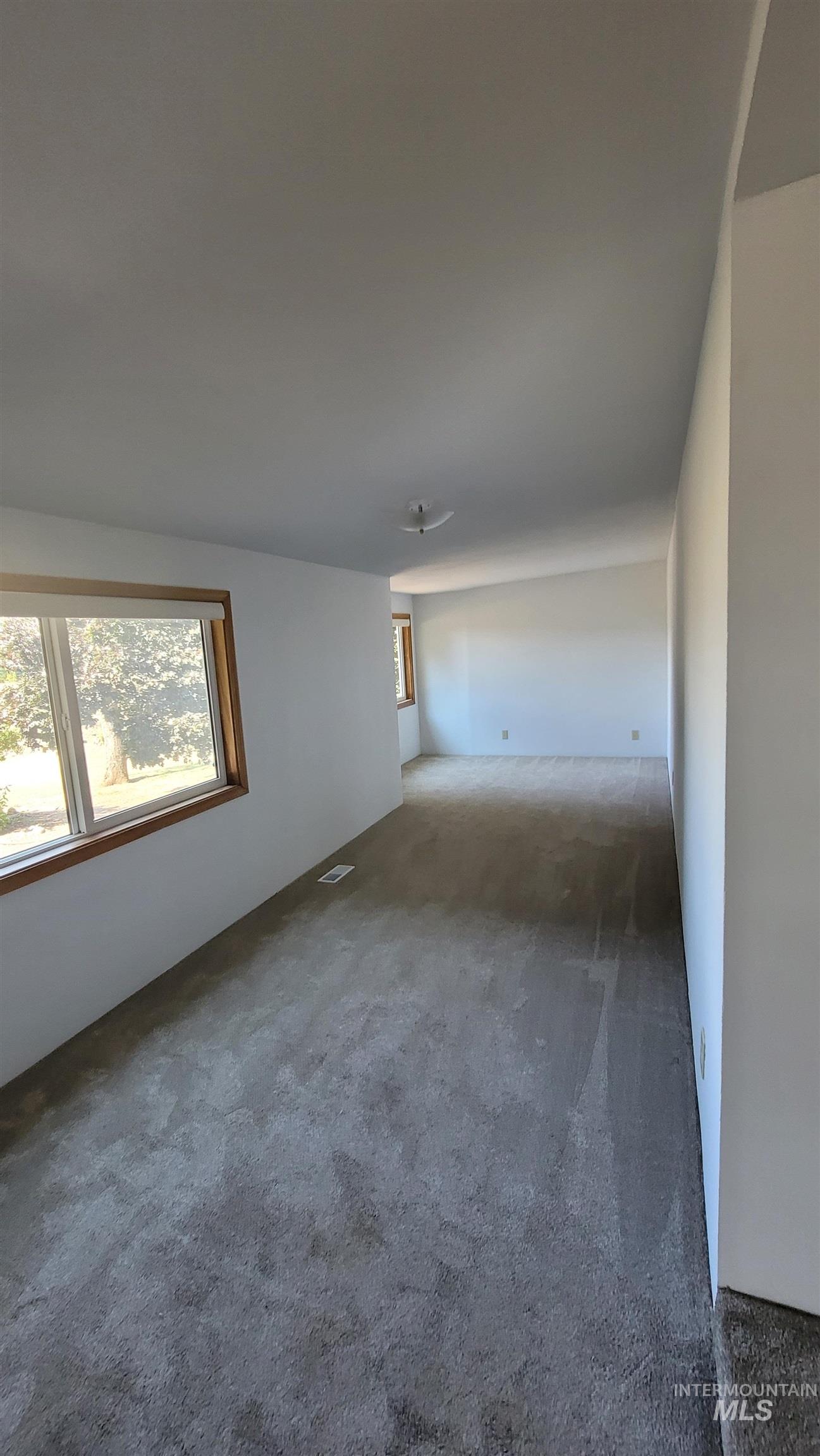 2122 Highway 95 Council, ID 83612 - Photo 22 of 31 Carpeted spare room with healthy amount of natural light