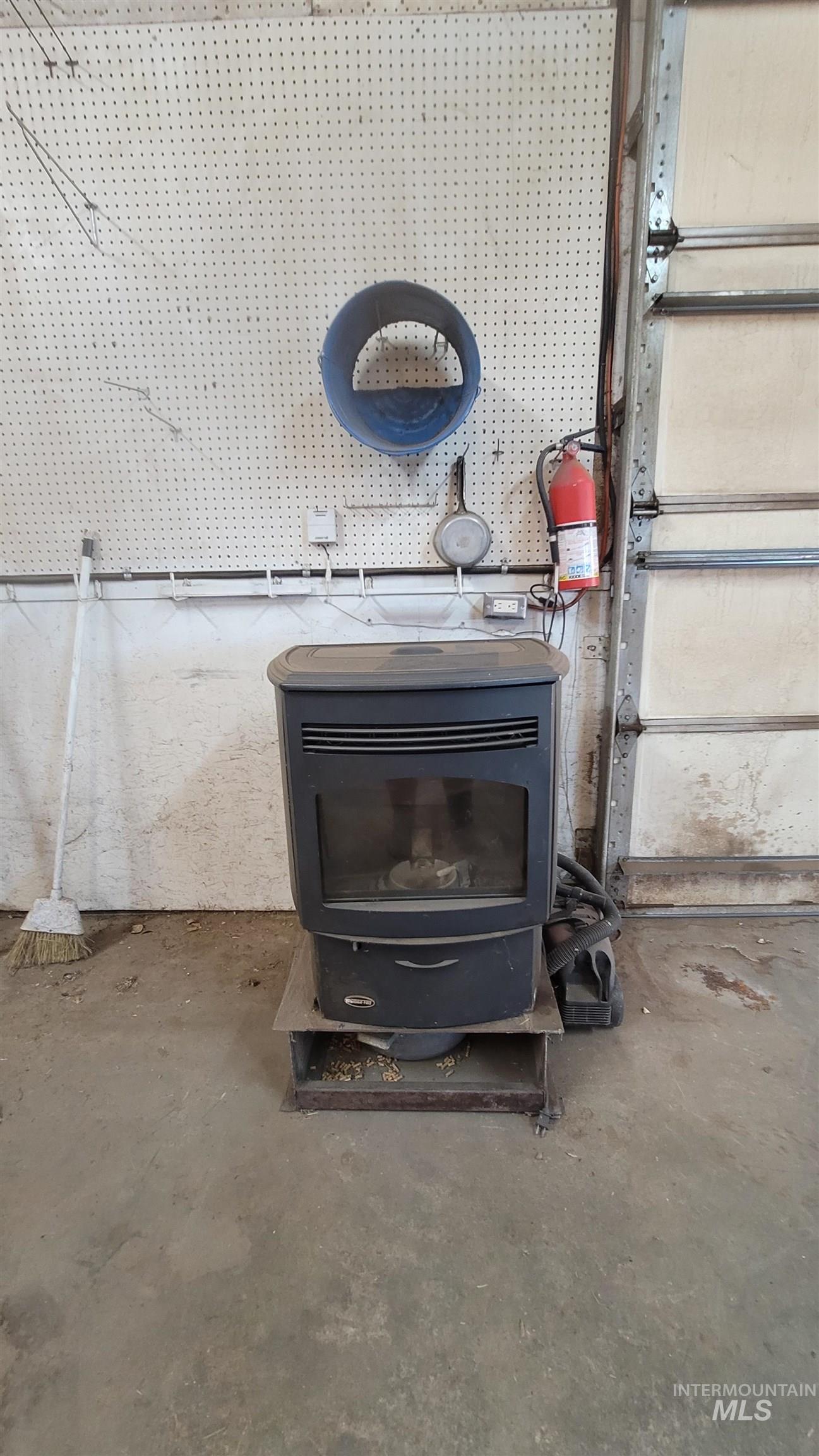 2122 Highway 95 Council, ID 83612 - Photo 28 of 31 Detailed view of concrete flooring and a wood stove