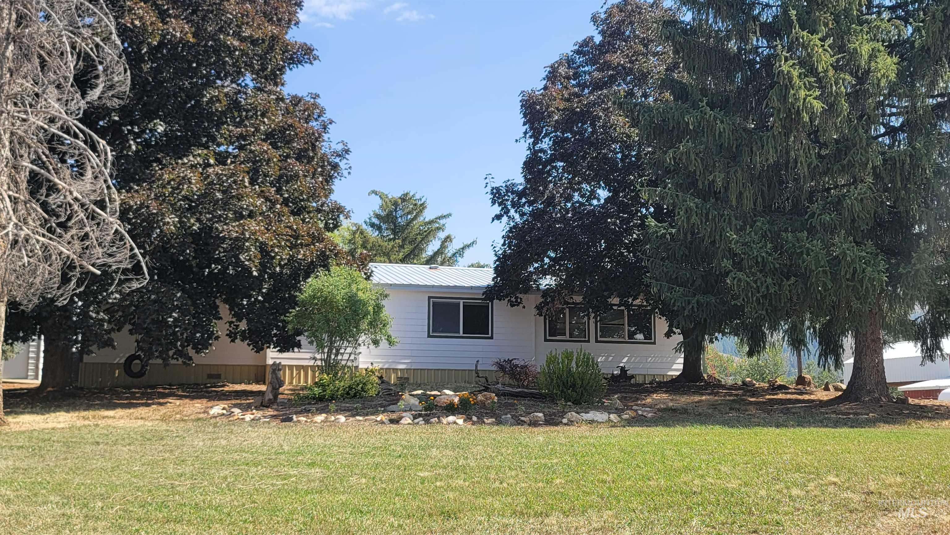 2122 Highway 95 Council, ID 83612 - Photo 6 of 31 View of front of home with a metal roof and a front lawn