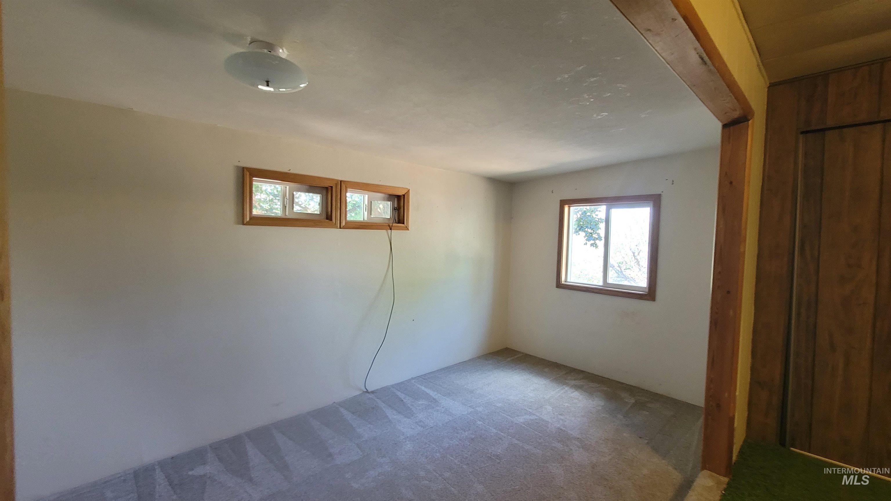 2122 Highway 95 Council, ID 83612 - Photo 10 of 31 Unfurnished room featuring carpet