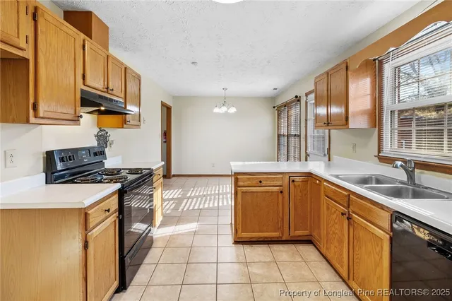 a kitchen with a stove and a cabinets