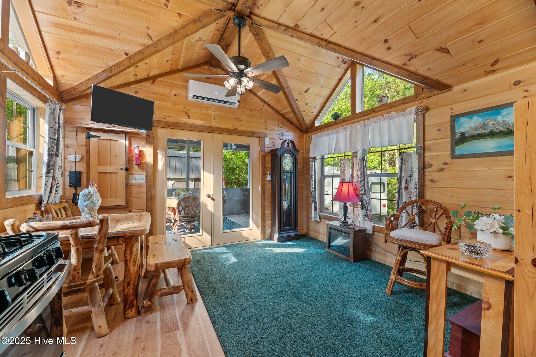 280 Charlie Road Arapahoe, NC 28510 - Photo 13 of 24 LIVINGROOM AND SCREENED PORCH