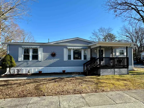 a front view of a house with a patio