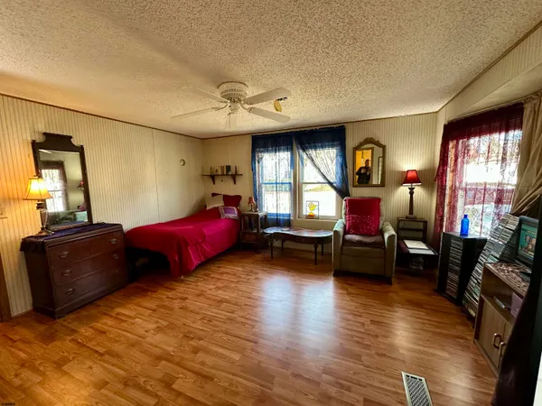 a living room with furniture window and wooden floor