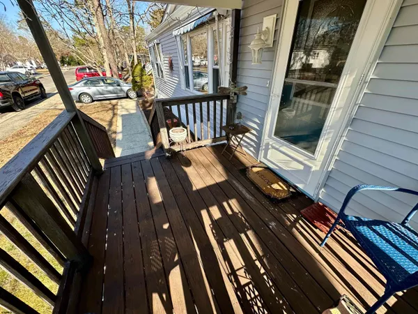 a view of outdoor space and deck with seating area