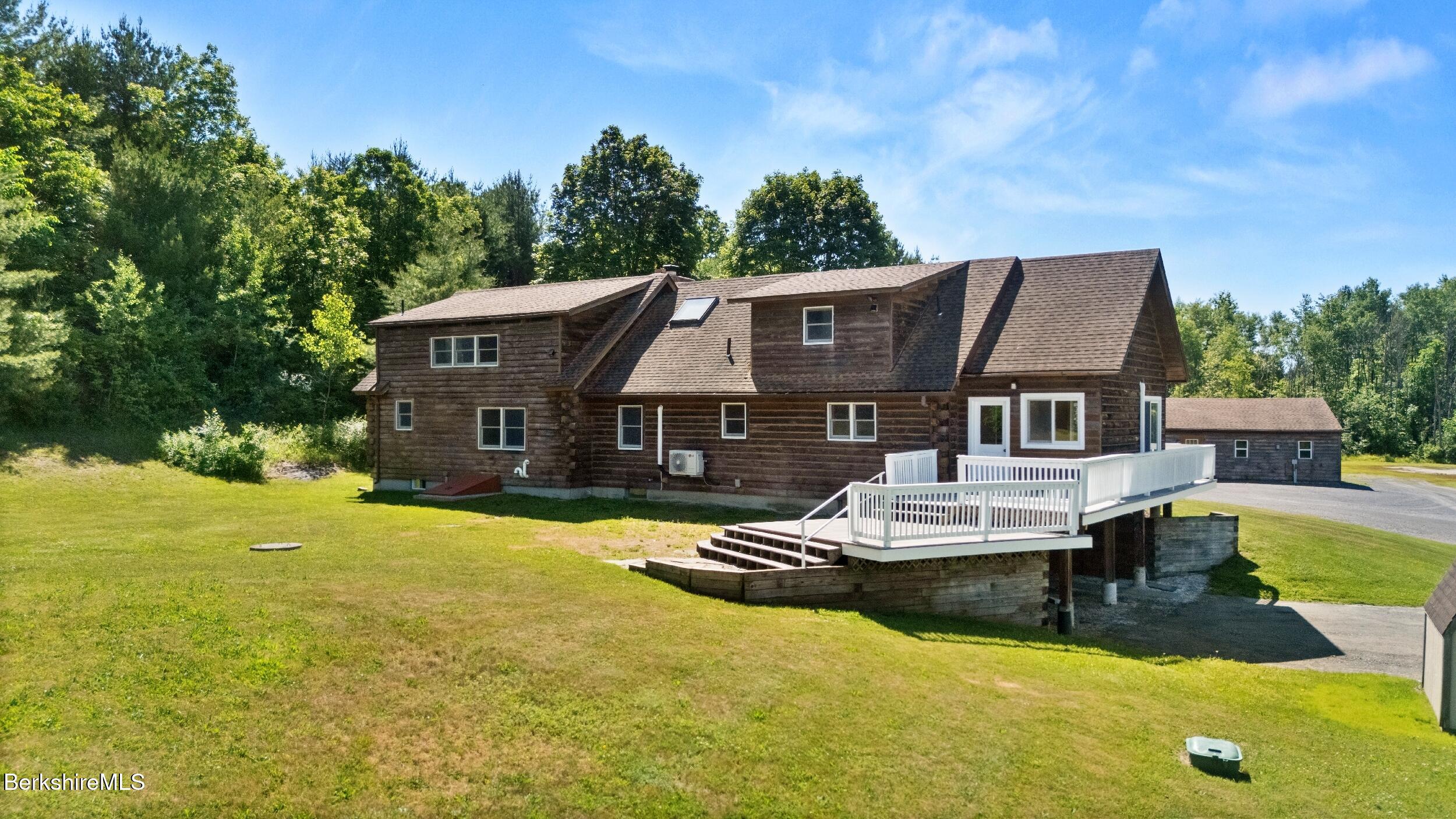 134 Hurlburt Road Great Barrington, MA 01230 - Photo 6 of 50 a view of a house with pool and chairs