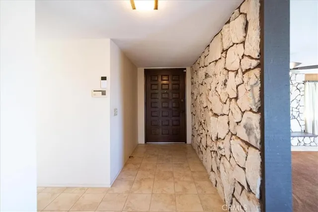 a living room with a balcony furniture and a large window