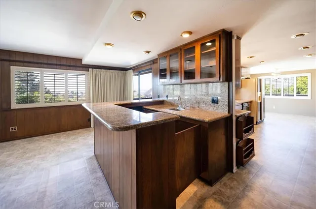 a kitchen with a sink and large window