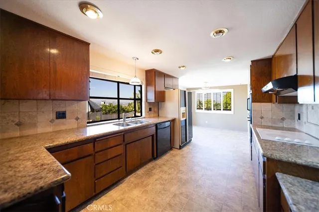 a kitchen with a sink and a window