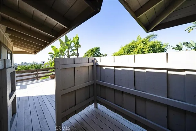 a front view of a house with a yard potted plants