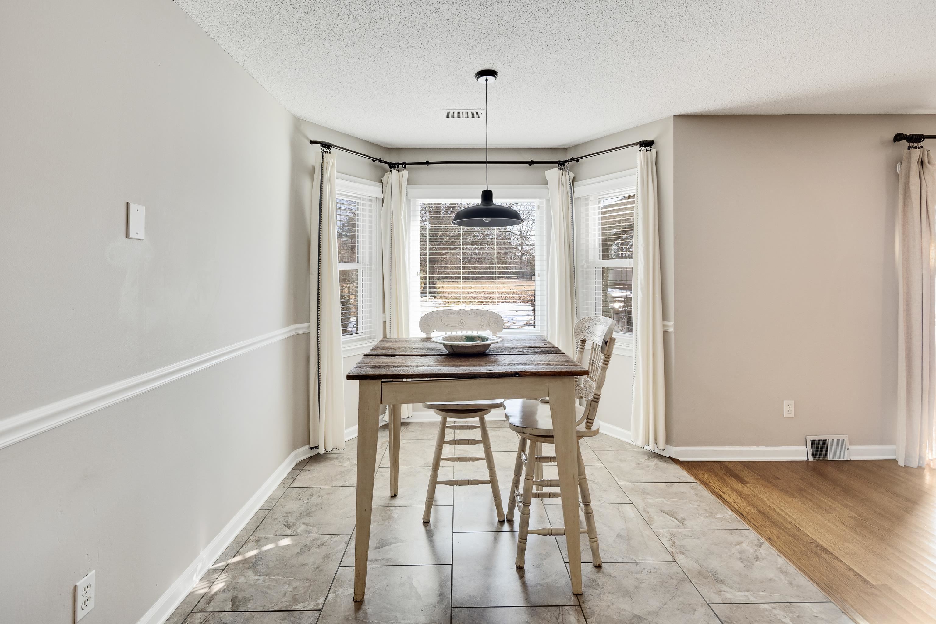 3888 Appling Road Bartlett, TN 38135 - Photo 12 of 21 a dining room with a table and chairs