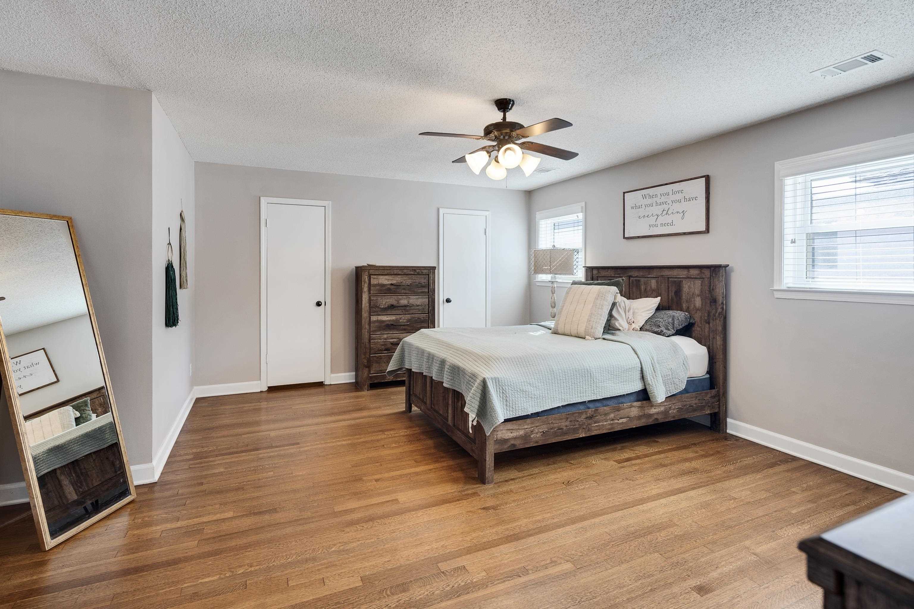 3888 Appling Road Bartlett, TN 38135 - Photo 15 of 21 a bedroom with a bed and wooden floor