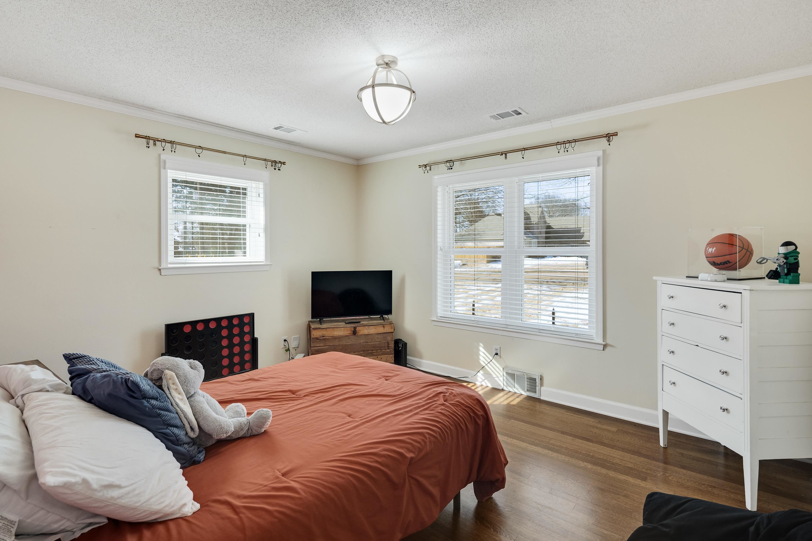 3888 Appling Road Bartlett, TN 38135 - Photo 17 of 21 a bedroom with a bed and wooden floor