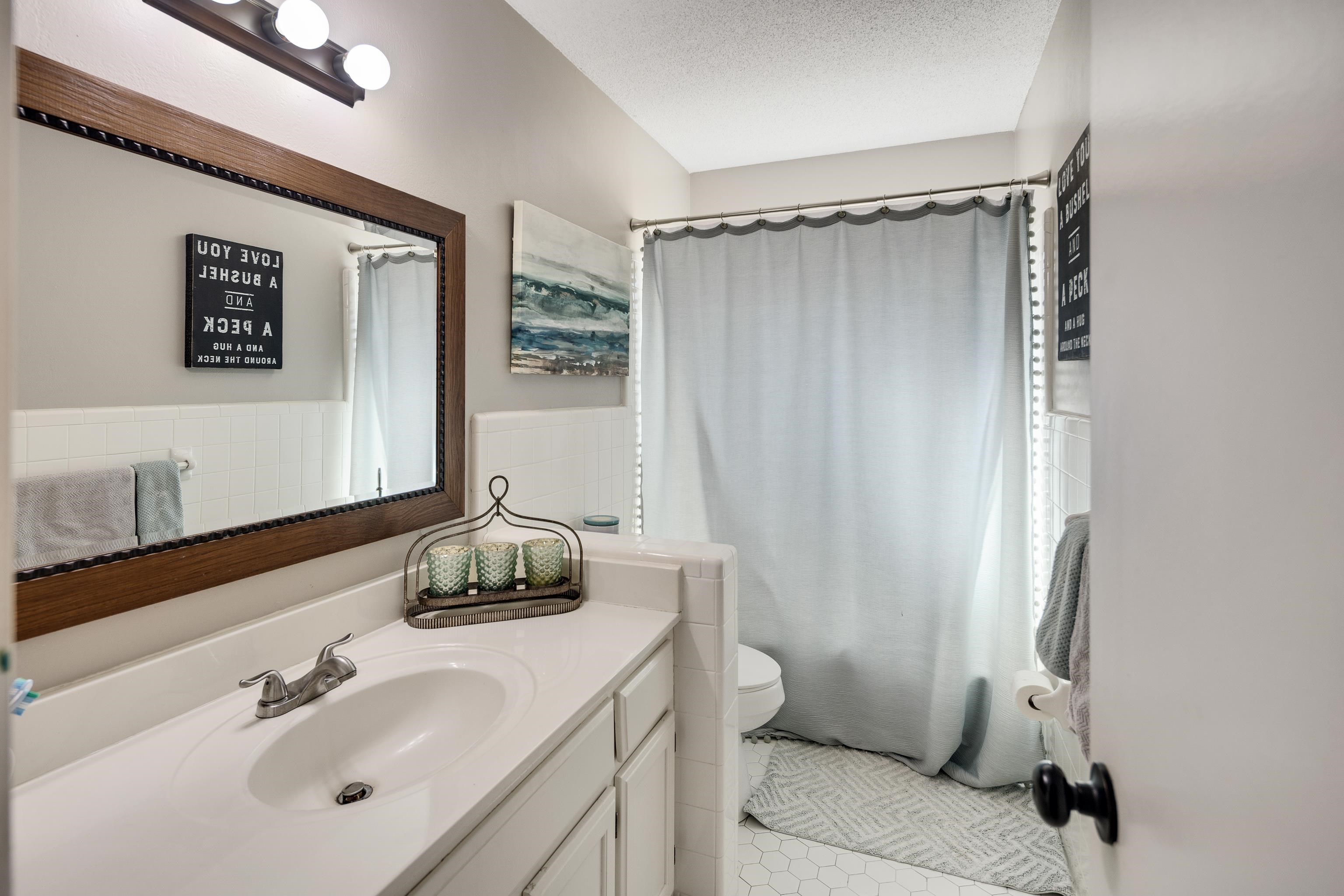 3888 Appling Road Bartlett, TN 38135 - Photo 18 of 21 a bathroom with a sink toilet and shower