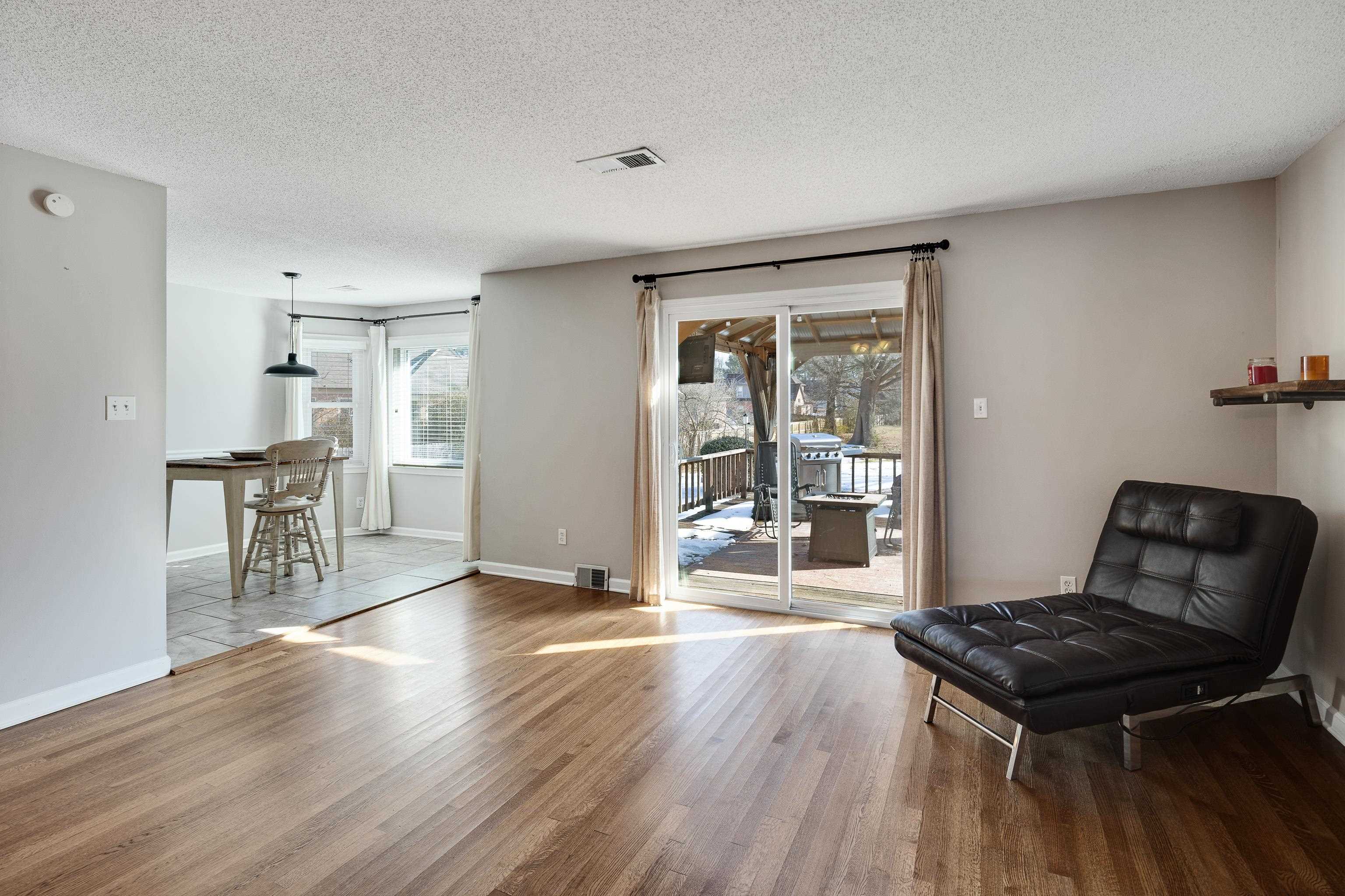 3888 Appling Road Bartlett, TN 38135 - Photo 8 of 21 a kitchen with granite countertop a stove and wooden floor