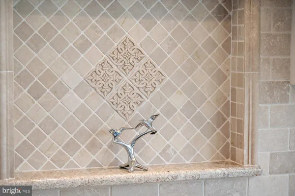 a view of a staircase with white walls and lots of windows