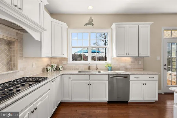 a spacious bedroom with a bed and a television
