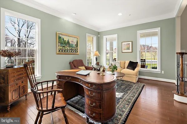 a spacious bathroom with a granite countertop sink mirror and