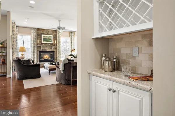 a view of a livingroom with furniture and a hallway