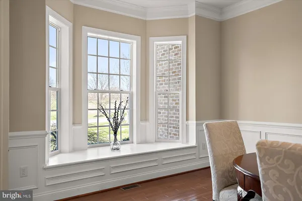 a bathroom with a granite countertop sink toilet and a mirror