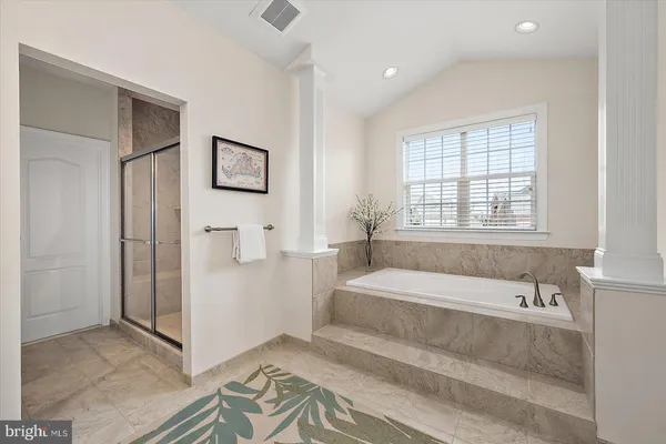 a front view of a house with a yard table and chairs