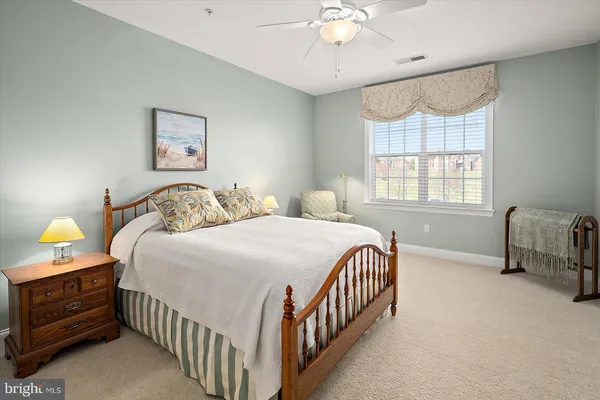a backyard of a house with a yard table and chairs