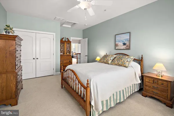 a view of swimming pool with outdoor seating and trees