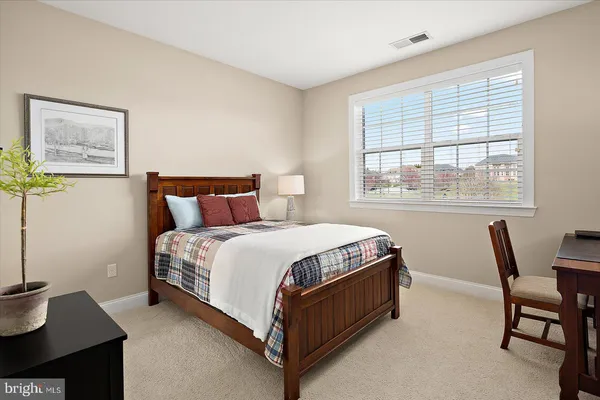 a front view of a house with a yard table and chairs