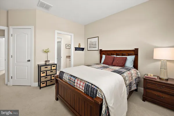 a front view of a house with a yard table and chairs