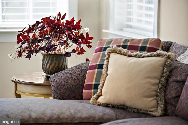 an aerial view of a house with garden space and swimming pool