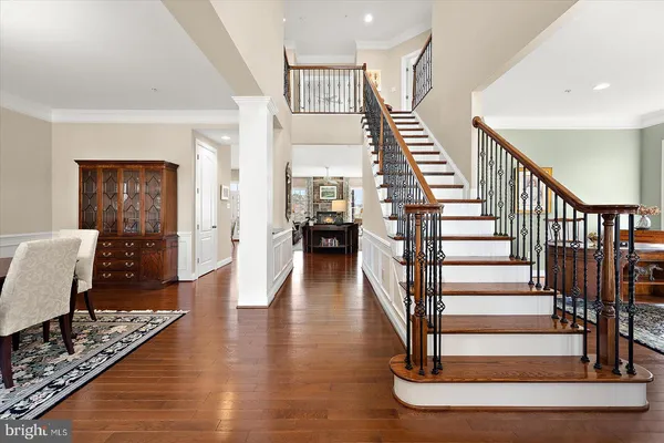 a view of a swimming pool and lounge chairs in back yard