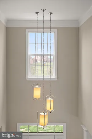 a front view of a house with garden and outdoor seating