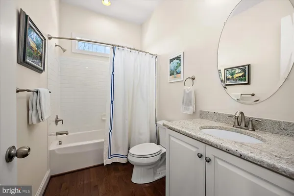 a front view of a house with a yard table and chairs