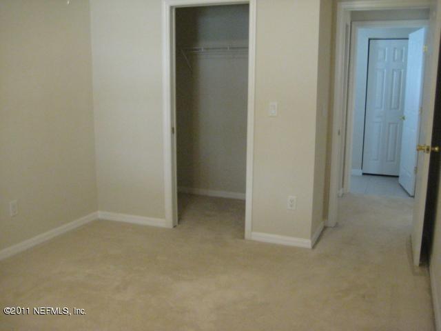 944 Ridgewood Lane St. Augustine, FL 32086 - Photo 9 of 22 Guest Bedroom with Walk-in Closet