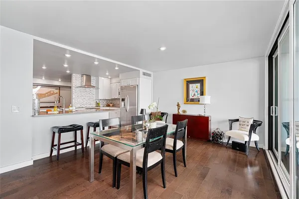 a view of a dining room with furniture and wooden floor