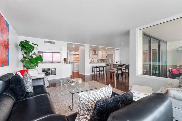a living room with furniture and a large window