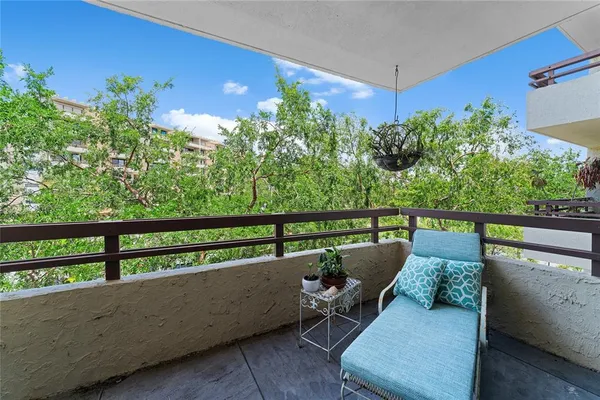 swimming pool view with a seating space