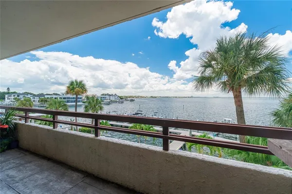 a view of swimming pool with outdoor seating and city view