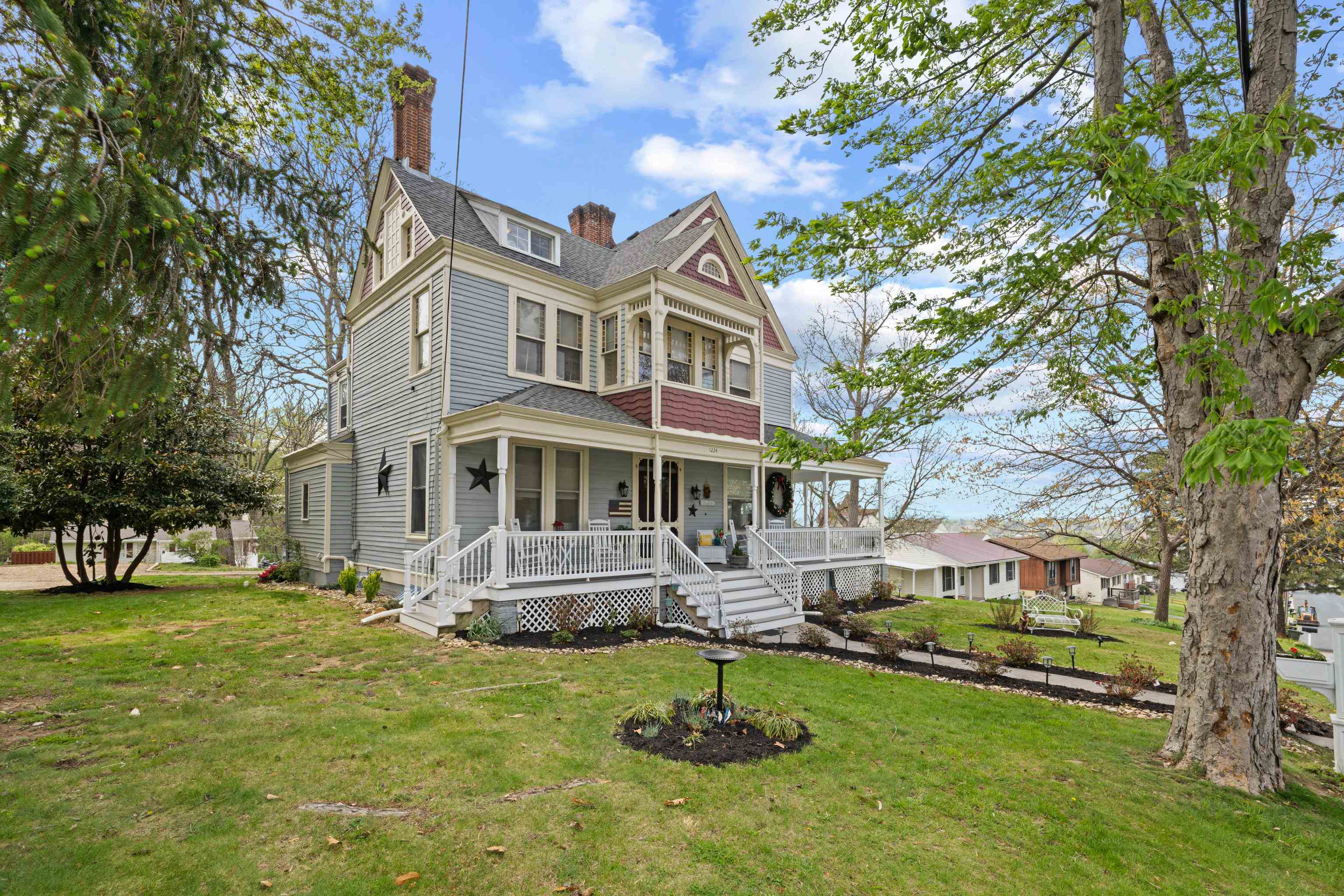 1224 4th Street Waynesboro, VA 22980 - Photo 1 of 75 a front view of a house with a yard table and chairs