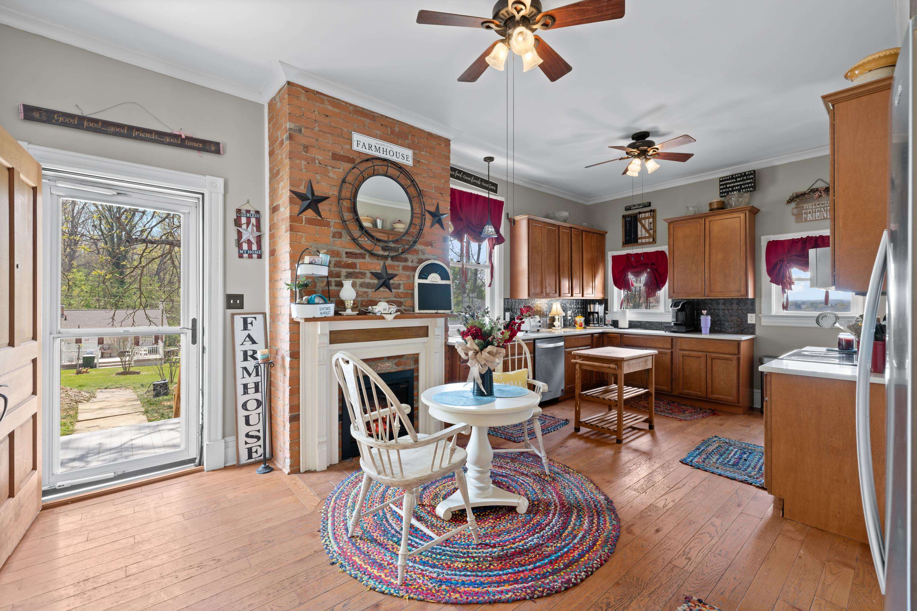 1224 4th Street Waynesboro, VA 22980 - Photo 21 of 75 a living room with furniture a fireplace and a window