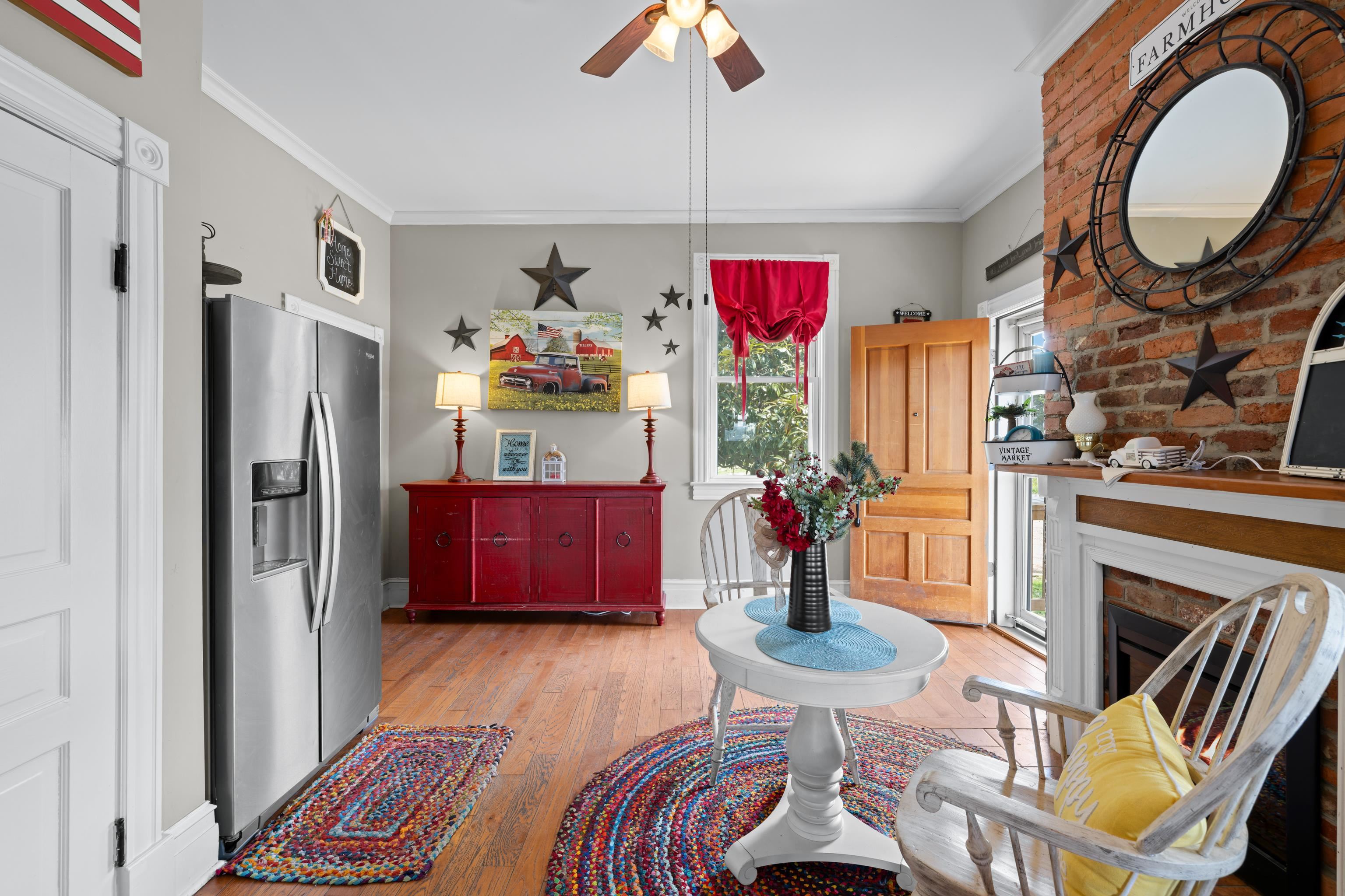 1224 4th Street Waynesboro, VA 22980 - Photo 32 of 75 a living room with furniture a fireplace and a chandelier