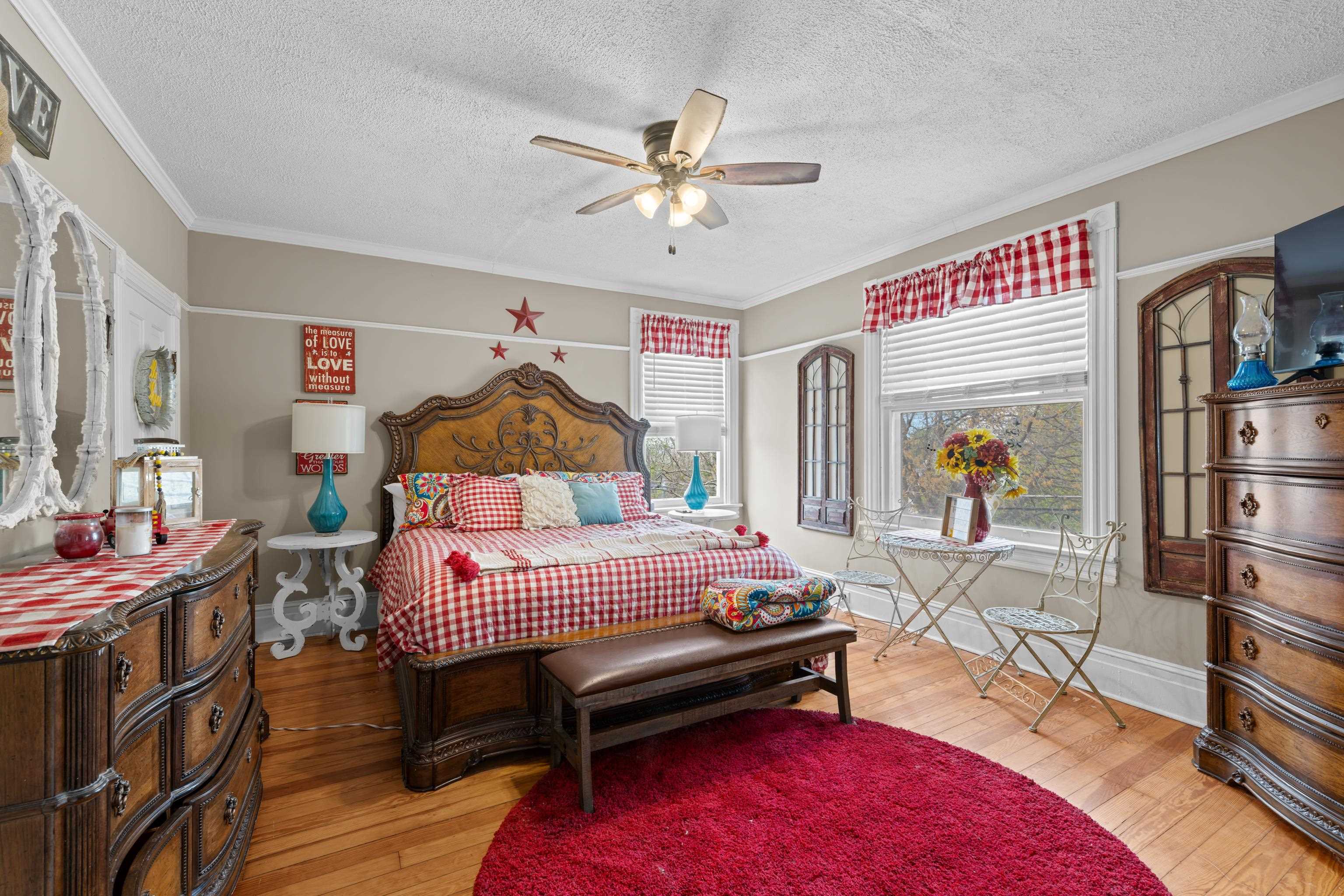 1224 4th Street Waynesboro, VA 22980 - Photo 37 of 75 a bedroom with a bed and a chandelier