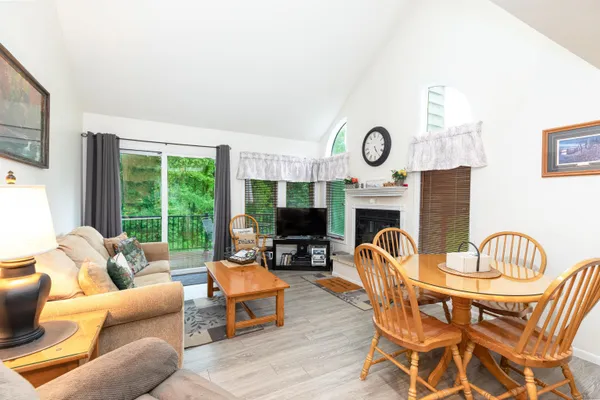 a living room with a fireplace a flat screen tv and a fireplace