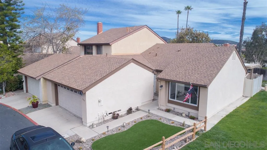 a aerial view of a house with a yard